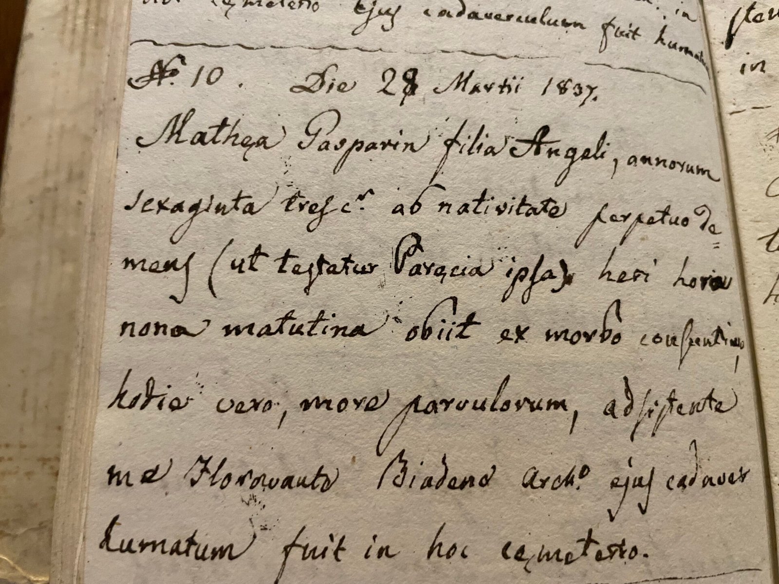 Four parish register volumes of Nati e Battezzati, 1818-1901, stacked on an archive shelf: the primary sources of Italian genealogical research