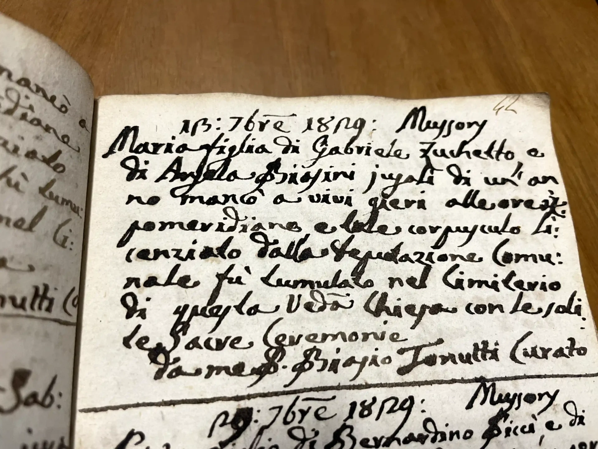 Italian parish register open on an archival desk