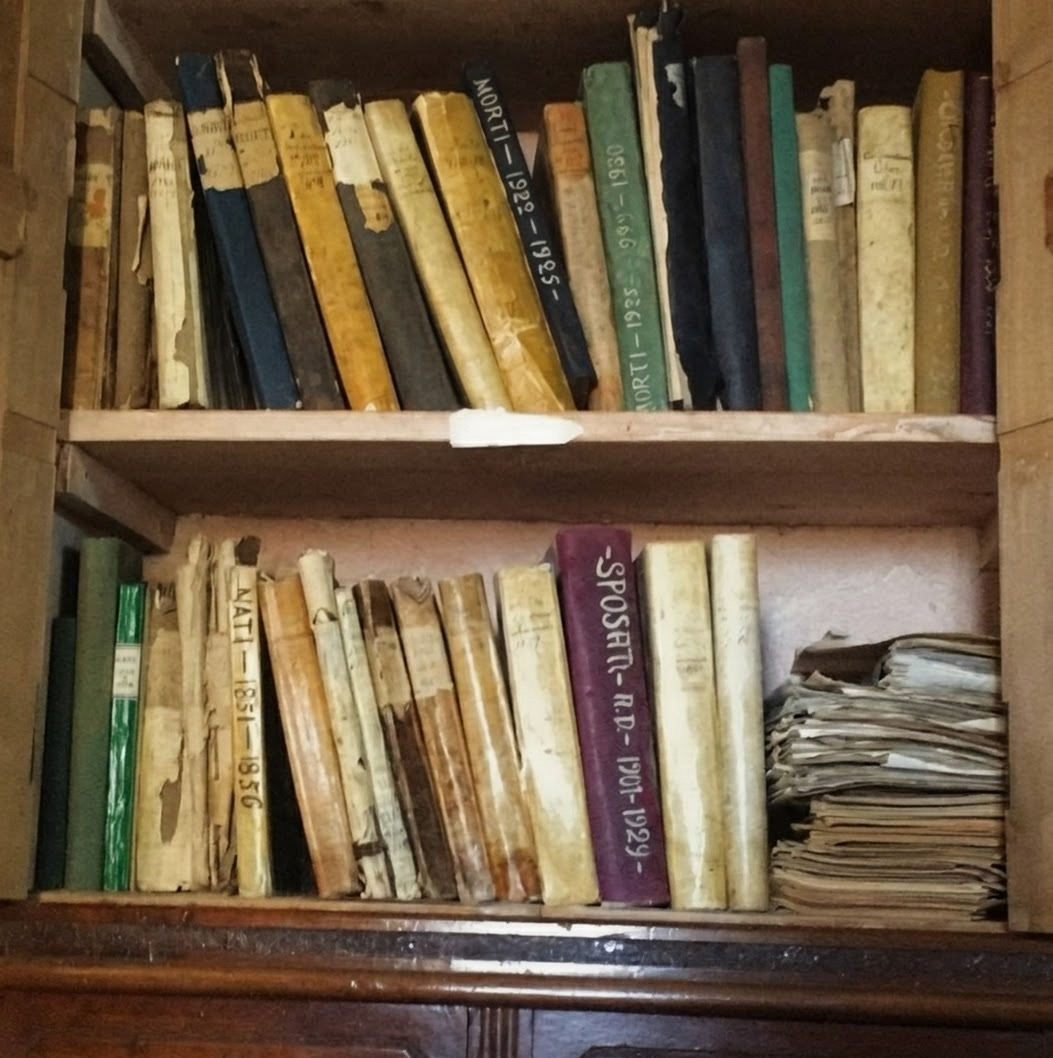 The library's working archive: one binder per Italian region, one label per family